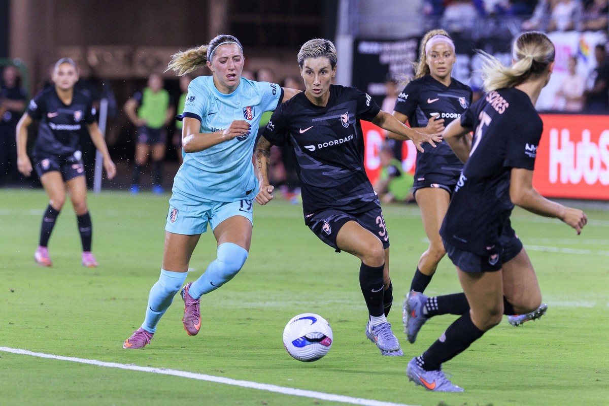 October 6, 2025, Los Angeles, California, USA: Mary Long 19 of the Kansas City Current attempts to steal the ball from Sara Doorsoun 30 of the Angel City FC during their regular season NWSL game on Mo ...