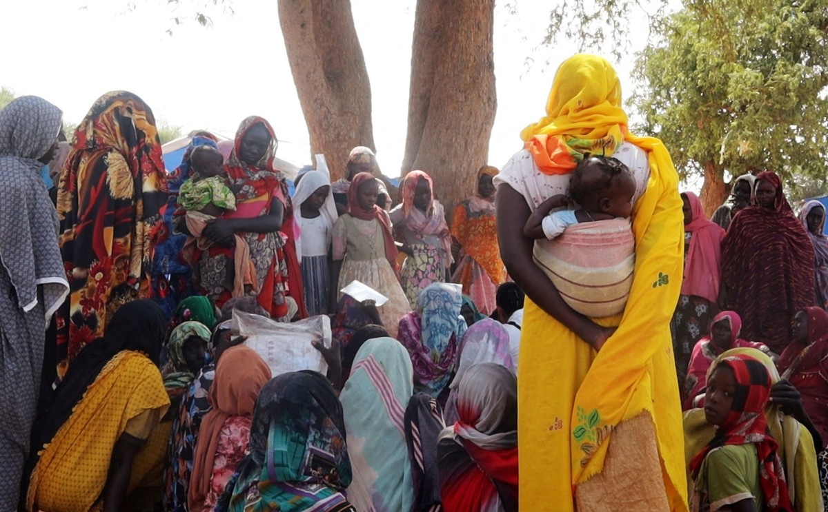 Masalit women gather under a neem tree to share stories about the deaths of their children and family members, mostly male, at a refugee camp in Adre, Chad November 12, 2023. The women fled to Chad as ...