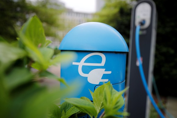 FILE PHOTO: A charging box for electric cars is pictured in front of the headquarters of the German power supplier RWE in Essen, Germany, April 24, 2018. REUTERS/Wolfgang Rattay/File Photo