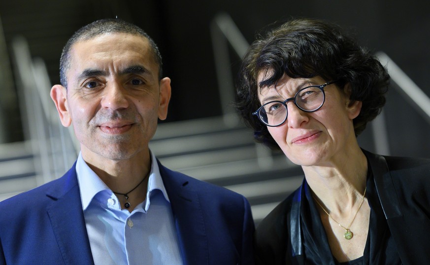 CORRECTING CAPTION DETAILS - Ugur Sahin, left, with his wife Ozlem Tureci, founders of the coronavirus vaccine developer BioNTech, pose for a photo at an Axel Springer Award ceremony for the research  ...