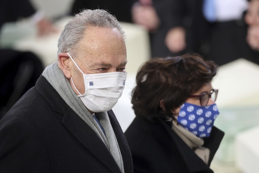 Sen. Chuck Schumer, D-N.Y., arrives with his wife Iris Weinshall before President-elect Joe Biden’s inauguration, Wednesday, Jan. 20, 2021, at the U.S. Capitol in Washington. (Jonathan Ernst/Pool Phot ...
