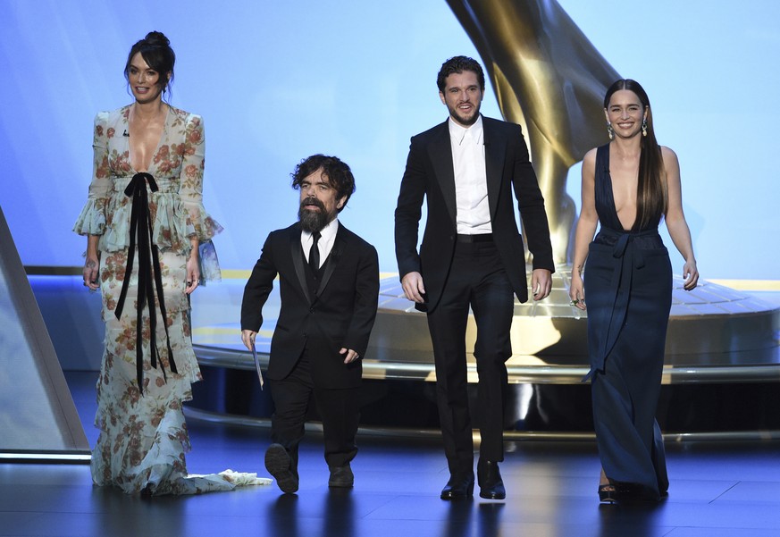 Lena Headey, from left, Peter Dinklage, Kit Harington and Emilia Clarke, of the cast of &quot;Game of Thrones,&quot; appear on stage to present the award for outstanding supporting actress in a limite ...