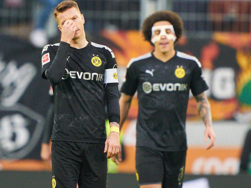 Trotz des 5:3-Siegs in Augsburg dürften Marco Reus und Maskenmann Axel Witsel nicht zufrieden mit der Leistung des BVB sein. 