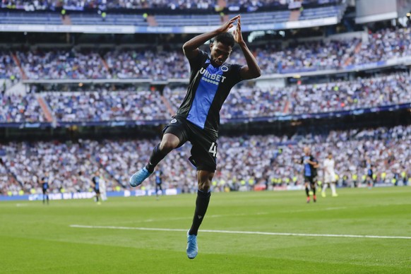 Brugge's Emmanuel Dennis celebrates after scoring his side's second goal during the Champions League group A soccer match between Real Madrid and Club Brugge, at the Santiago Bernabeu stadium in Madri ...
