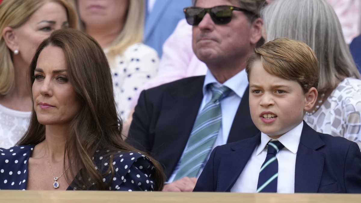 Britain's Kate, Duchess of Cambridge and Prince George are seen in the royal box before the final of the men's singles on day fourteen of the Wimbledon tennis championships in London, Sunday ...