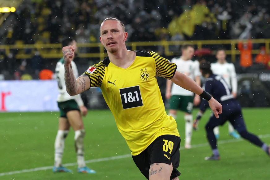 DORTMUND, GERMANY - FEBRUARY 20: Marius Wolf of Borussia Dortmund celebrates after scoring their team&#039;s third goal during the Bundesliga match between Borussia Dortmund and Borussia Mönchengladba ...