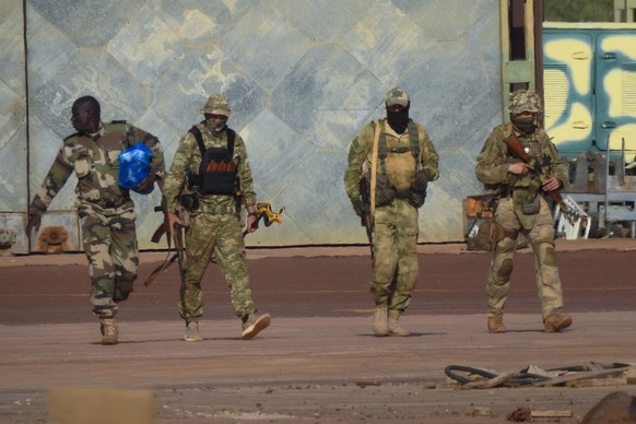 FILE - This undated photograph provided by the French military shows three Russian mercenaries, in northern Mali. On July 27-28, 2023 Russian President Vladimir Putin is hosting delegations from almos ...