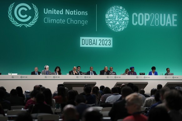 Sameh Shoukry, COP27 president, center, attends the opening session at the COP28 U.N. Climate Summit, Thursday, Nov. 30, 2023, in Dubai, United Arab Emirates. (AP Photo/Peter Dejong)