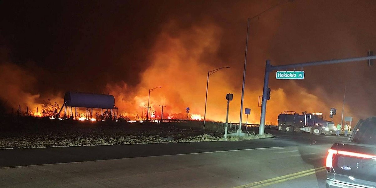 August 9, 2023, Lahaina, Hawaii, Maui, USA: A wildfire burns on the island of Maui near an intersection in Lahaina, Hawaii in an image provided by the on August 9, 2023. Wildfires burned across Hawaii ...