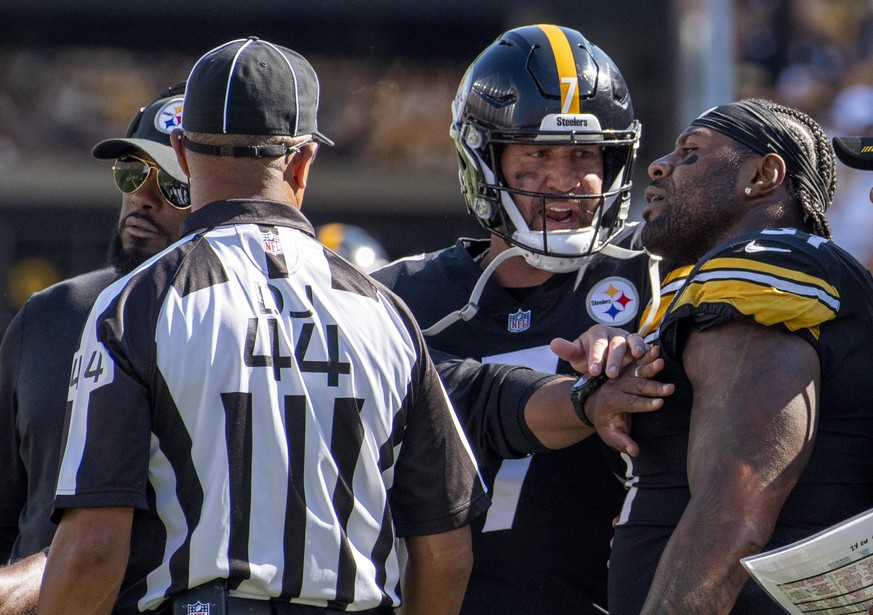Pittsburgh Steelers head coach Mike Tomlin and Pittsburgh Steelers quarterback Ben Roethlisberger 7 restrains Pittsburgh Steelers offensive guard Trai Turner 51 after he is disqualified in the fourth  ...
