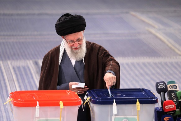 March 1, 2024, Tehran, Iran: Iranian Supreme Leader Ayatollah ALI KHAMENEI casts his vote during the parliamentary and assembly of experts elections at a polling station in Tehran. Iranians vote for n ...