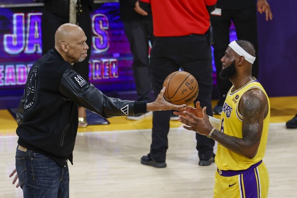 February 7, 2023, Los Angeles, California, USA: Kareem Abdul-Jabbar presents a ball to Los Angeles Lakers forward LeBron James 6 after he scoring to pass Kareem Abdul-Jabbar to become the NBA, Basketb ...