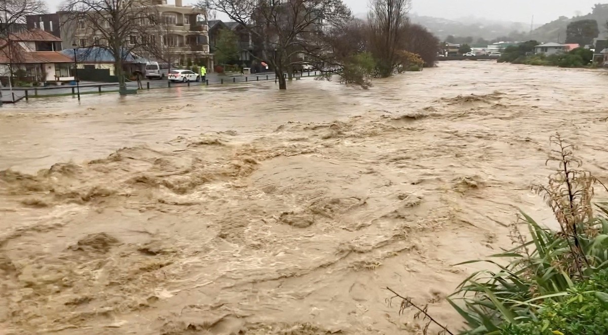 FILE PHOTO: Flood waters run through city of Nelson, New Zealand August 17, 2022 in this still image obtained from a video. Peter Gibbs/via REUTERS