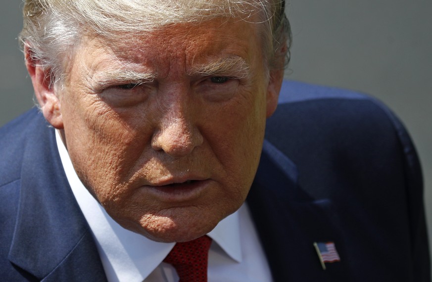President Donald Trump speaks with reporters before departing on Marine One on the South Lawn of the White House, Wednesday, Aug. 21, 2019, in Washington. Trump is headed to Kentucky. (AP Photo/Patric ...