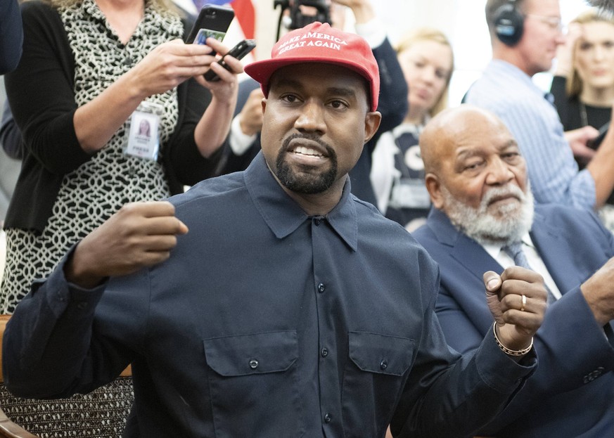 **FILE PHOTO** Kanye West Dropped by Adidas. Kanye West, left, makes a statement to the media as he meets with United States President Donald J. Trump and Jim Brown, right, in the Oval Office of the W ...