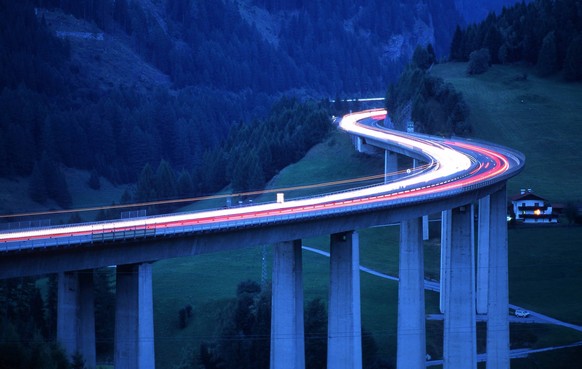 The Brenner Highway at dawn. This is the most important road over the Central Alps. It connects Austria s Tyrol region with Southern Tyrol region in Italy and requires a toll-charge. The Brenner Highw ...