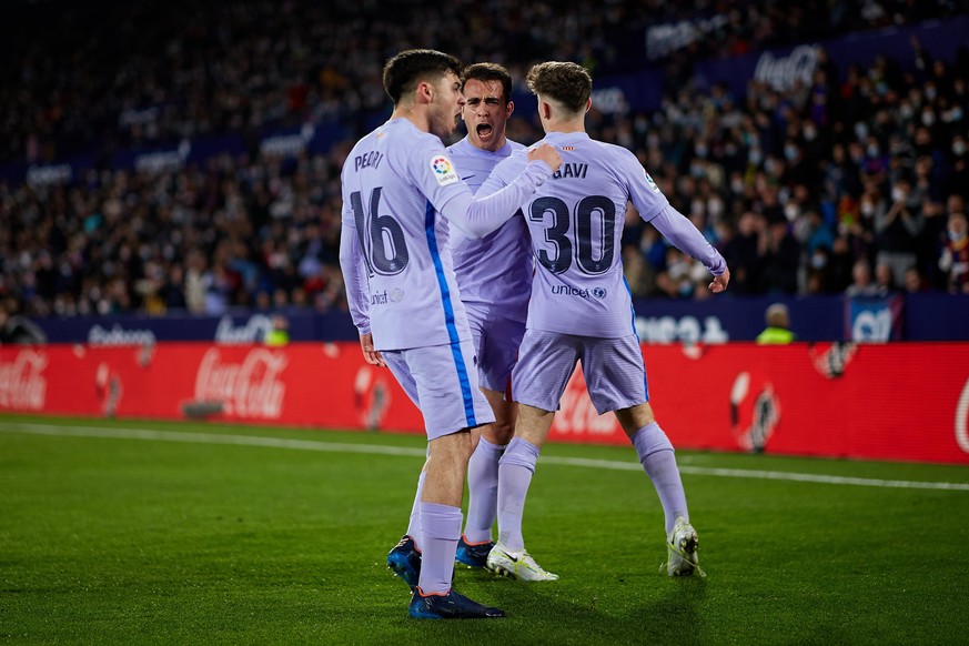 Pedri (L) of FC Barcelona celebrates his side&#039;s second goal with his teammates Gavi (R) and Eric Garcia during the La Liga Santander match between Levante UD and FC Barcelona at Ciutat de Valenci ...