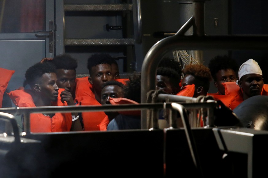 Migrants from the German rescue ship &quot;Alan Kurdi&quot; arrive on an Armed Forces of Malta vessel at its base in Marsamxett Harbour, Valletta, Malta July 7, 2019. REUTERS/Darrin Zammit Lupi