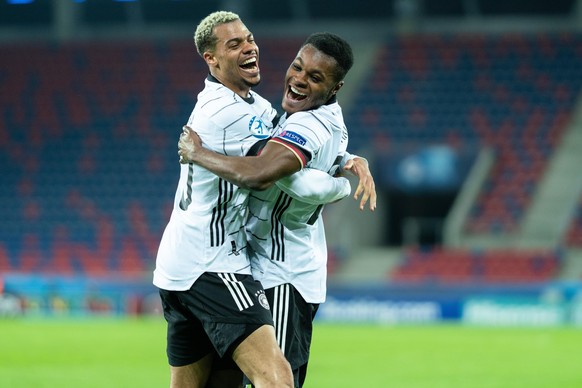 Szekesfehervar, Hungary. 24th, March 2021. Bote Baku (21) of Germany scores for 0-2 and celebrates with Lukas Nmecha (10) during the UEFA EURO U-21 match between Hungary and Germany at Sostoi Stadion  ...