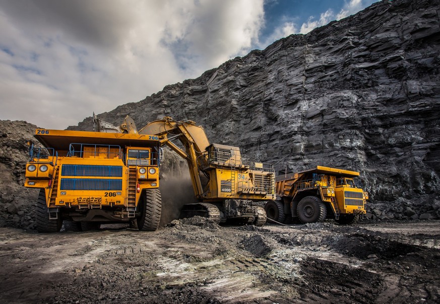 Coal production at one of the open fields in the south of Siberia. Dumpers &quot;BelAZ&quot;. September 2015.