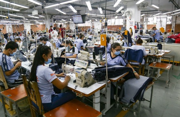 CUCUTA, COLOMBIA - JUNE 02: Workers manufacture denims at a clothing factory where 700 employees work and more than 5000 jeans are produced, in Cucuta, Colombia, on June 02, 2022. The denim industry i ...