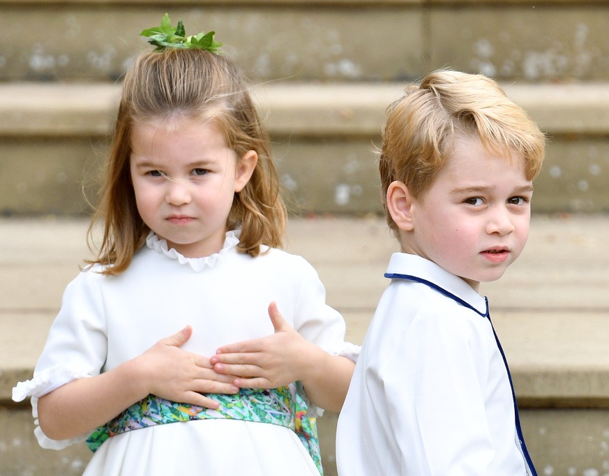 WINDSOR, UNITED KINGDOM - OCTOBER 12: (EMBARGOED FOR PUBLICATION IN UK NEWSPAPERS UNTIL 24 HOURS AFTER CREATE DATE AND TIME) Princess Charlotte of Cambridge and Prince George of Cambridge attend the w ...