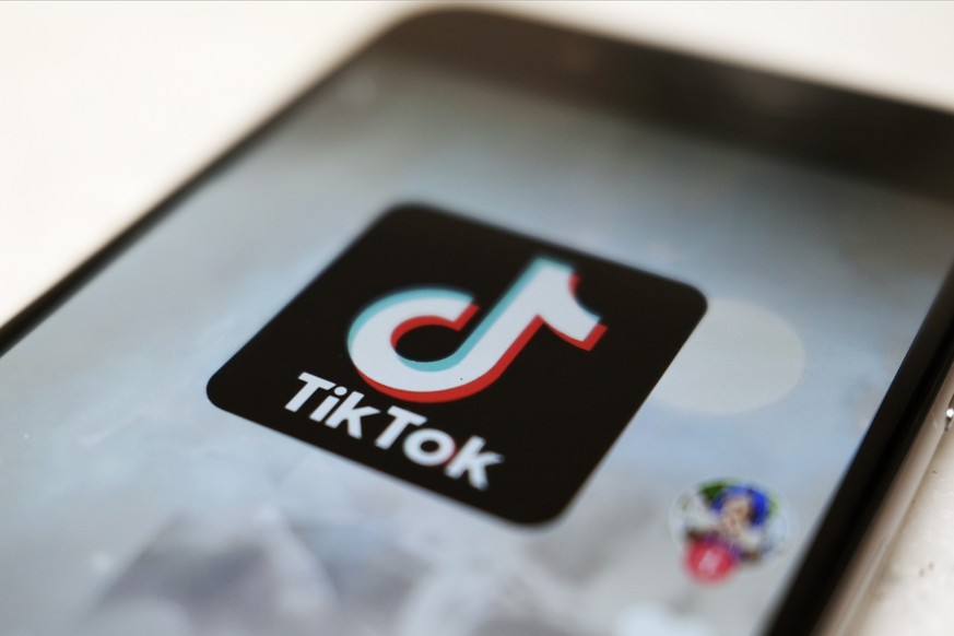 FILE - This Monday, Sept. 28, 2020, file photo, shows as logo of a smartphone app TikTok on a user post on a smartphone screen in Tokyo. A single viral video on TikTok can launch your business into th ...