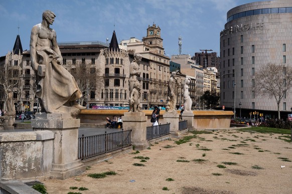 March 19, 2024, Barcelona, Catalonia, Spain: A large dry land due to lack of irrigation is seen in Plaza de Catalunya. As a consequence of water restrictions due to drought and despite the efforts of  ...
