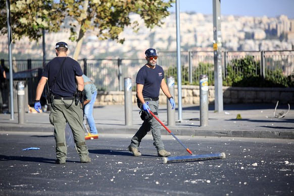 Israeli forensic experts gather at the scene of an explosion at a bus stop Israeli forensic experts gather at the scene of an explosion at a bus stop in Jerusalem on November 23, 2022. At least one pe ...
