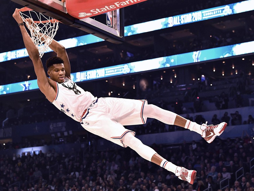 February 17, 2019 - Charlotte, NC, USA - Milwaukee Bucks Giannis Antetokounmpo swings on the rim after throwing down a two-handed dunk during the NBA Basketball Herren USA All-Star Game at Spectrum Ce ...
