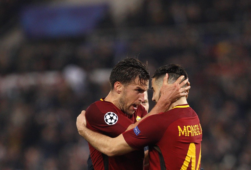 Italy Soccer Uefa Champions League: Roma vs FC Barcelona Barca Roma s Kevin Strootman, left, and Kostas Manolas celebrate at the end of the Champions League quarter final second leg soccer match betwe ...
