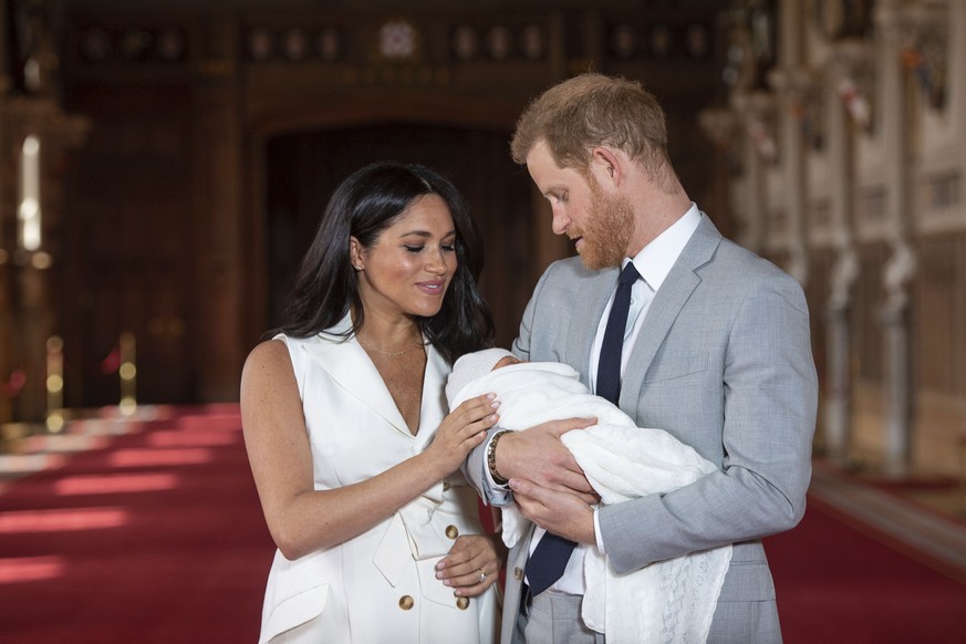 FILE - In this Wednesday May 8, 2019 file photo, Britain's Prince Harry and Meghan, Duchess of Sussex, pose during a photocall with their newborn son Archie, in St George's Hall at Windsor Castle, Win ...