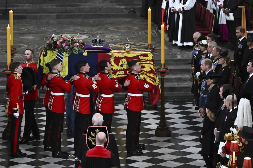 The Bearer Party of The Queen&#039;s Company, 1st Battalion Grenadier Guards carries the coffin of Queen Elizabeth II, draped in a Royal Standard and adorned with the Imperial State Crown and the Sove ...