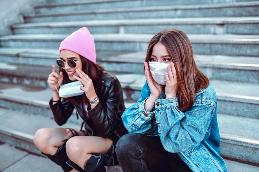 Cute Females Trying To Protect Themselves From Virus With Surgical Masks