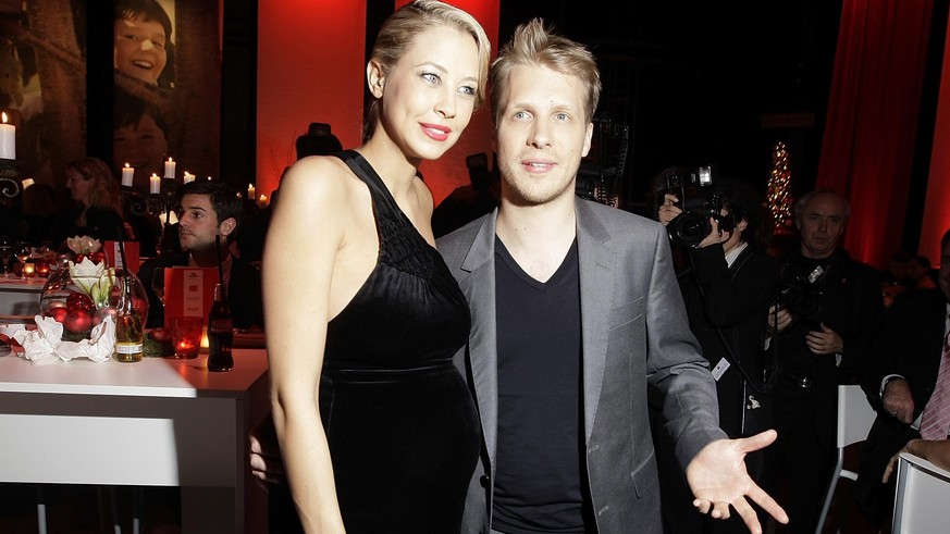 BERLIN - DECEMBER 12: (EDITORS NOTE: Entertainment Online Subscriptions GLR Included) Oliver Pocher and girlfriend Sandy Meyer-Woelden attend the aftershow party of &#039;Ein Herz fuer Kinder&#039; Ga ...