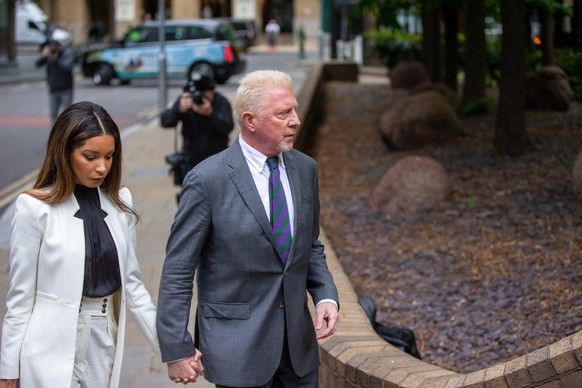 April 29, 2022, London, England, United Kingdom: Former German tennis star BORIS BECKER with his partner LILIAN DE CARVALHO MONTEIRO arrives at Southwark Crown Court in London for sentencing. (Credit  ...