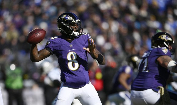 Baltimore Ravens quarterback Lamar Jackson (8) looks to pass in the first half of an NFL football game against the Carolina Panthers Sunday, Nov. 20, 2022, in Baltimore. (AP Photo/Nick Wass)