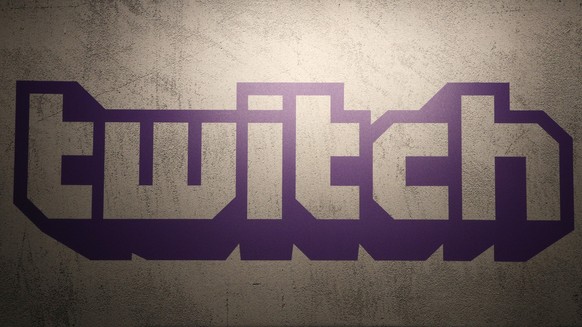 FILE - The logo for live-streaming video platform Twitch is seen on Nov. 4, 2017, at the Paris games week in Paris, France. Twitch, a popular video service, will shut down its struggling business in S ...