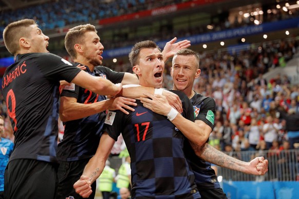 Croatian forward Mario Mandzukic (2R) celebrates after scoring during the FIFA World Cup WM Weltmeisterschaft Fussball 2018 semi-finals soccer match between Croatia and England, at Luzhniki Stadium in ...
