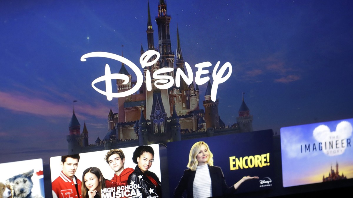 FILE - A Disney logo forms part of a Disney Plus menu on a computer screen in Walpole, Mass., on Nov. 13, 2019. (AP Photo/Steven Senne, File)