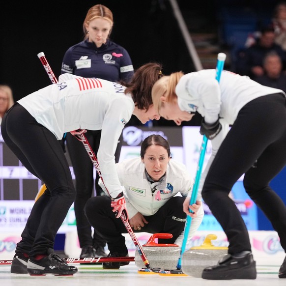 March 20, 2024, Sydney, Ns, Canada: United States skip Tabitha Peterson, bottom centre, directs the line of the stone for teammates Tara Peterson, left, and Cory Thiesse in front of Scotland skip Rebe ...