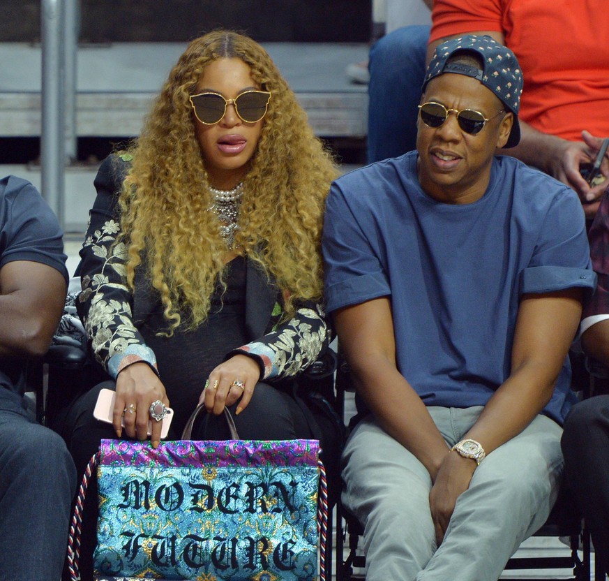Beyonce and Jay Z sit courtside as they attend Game 7 of the best-of-seven first round playoffs between the Los Angeles Clippers and the Utah Jazz at Staples Center in Los Angeles on April 30, 2017. B ...