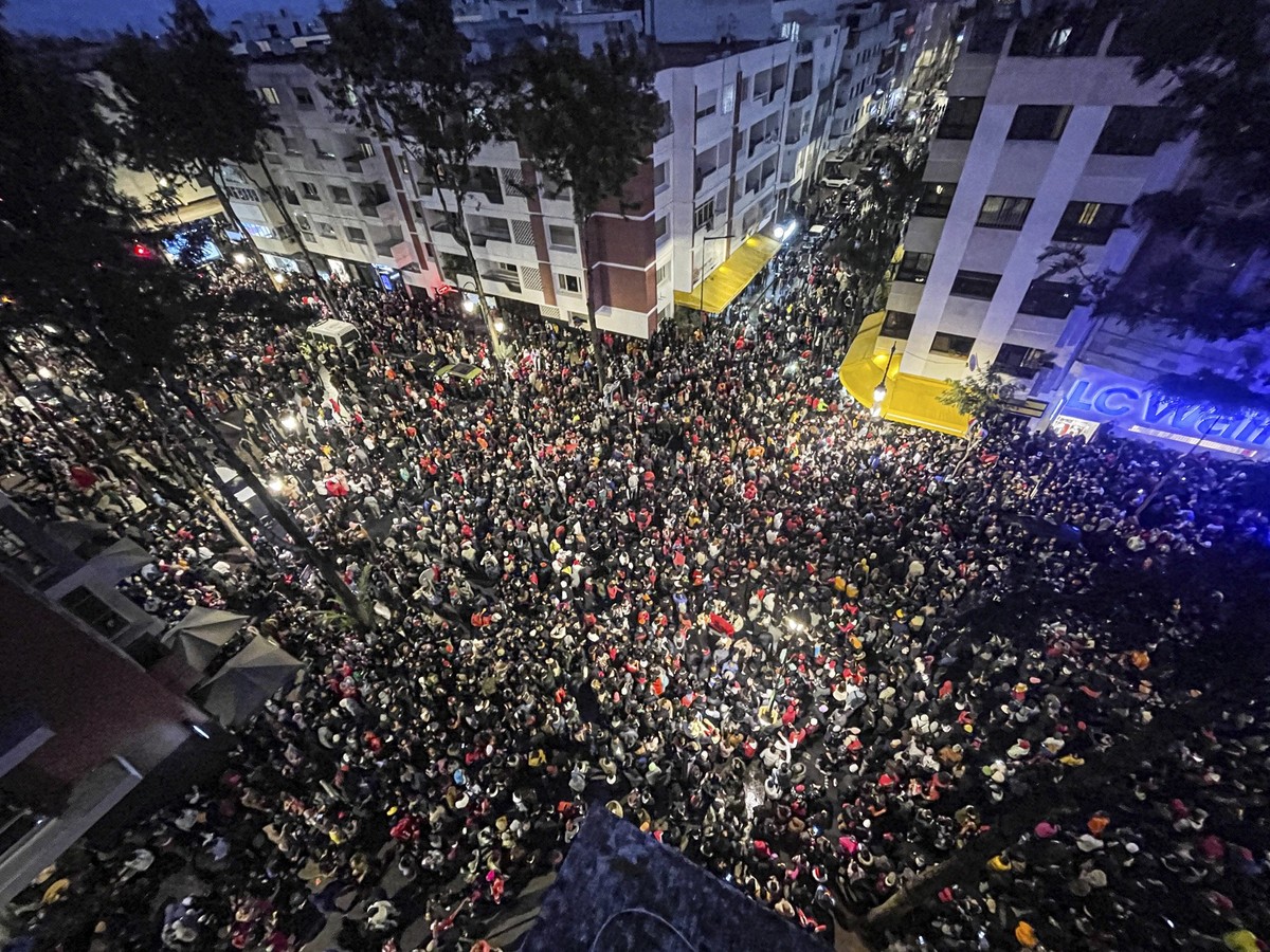 Morocco soccer fans celebrate after their national team beat Canada 2-1 and qualified to the knockout stages at a World Cup soccer match played in Qatar, in Rabat, Morocco, Thursday, Dec. 1, 2022. (AP ...