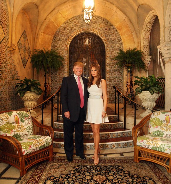 February 18, 2011 - Palm Beach, Florida, U.S. - 021811 ( /The Palm Beach Post) DELRAY BEACH - Donald and Melania Trump pose for a photo in front of their favorite spot at Mar a Lago...In 2011, Donald  ...