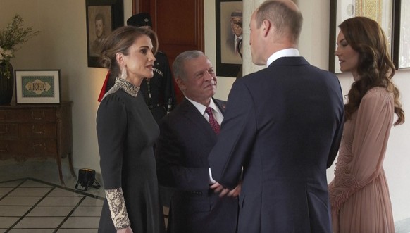 King Abdullah II and Queen Rania greet Britain&#039;s Prince William and his wife, Kate, before the marriage ceremony of Crown Prince Hussein and Saudi architect Rajwa Alseif, Thursday, June 1, 2023 i ...