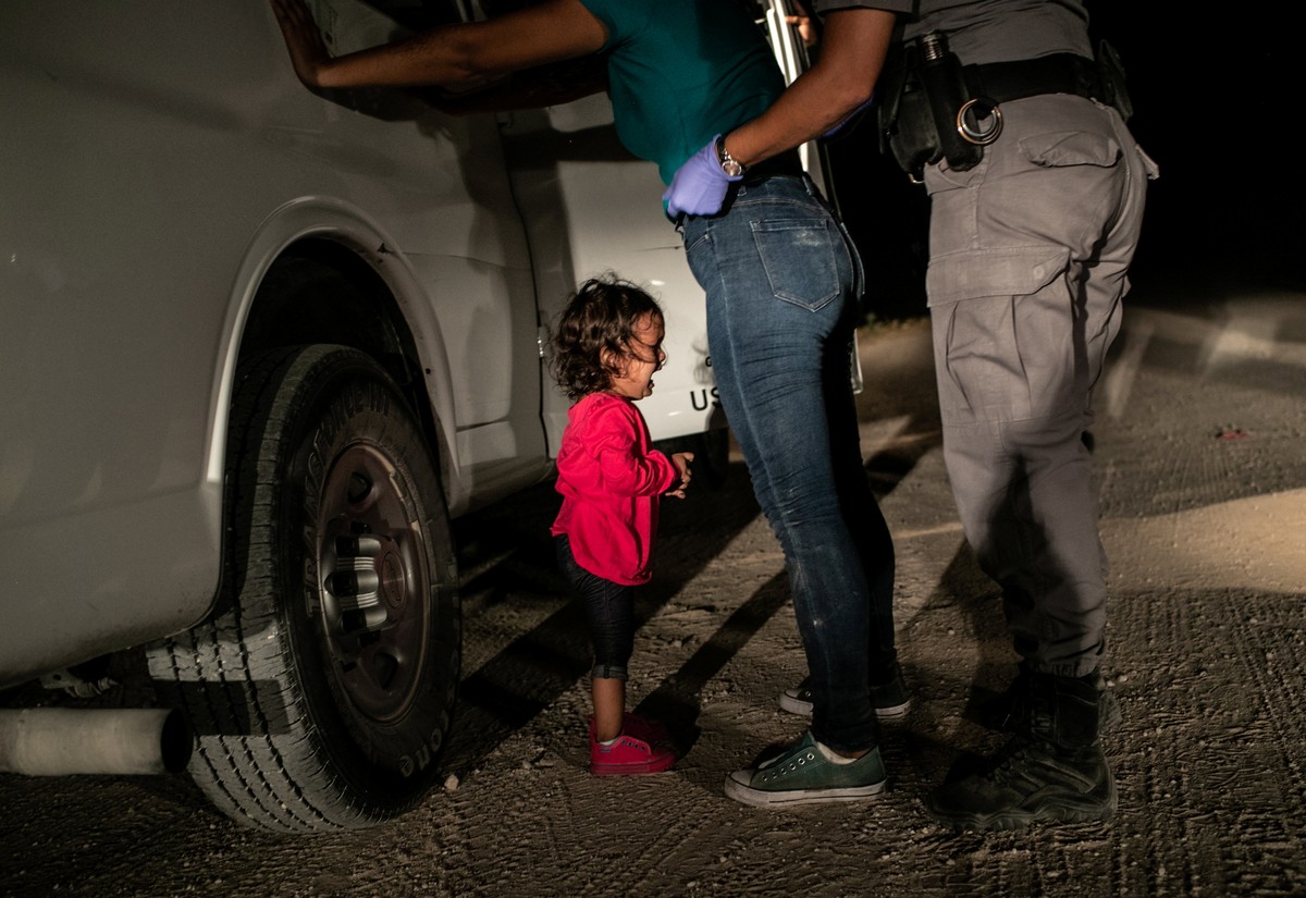 Picture nominated for World Press Photo of the Year at the World Press photo contest shows: Yana, from Honduras, cries as her mother Sandra Sanchez is searched by a US Border Patrol agent, in McAllen, ...