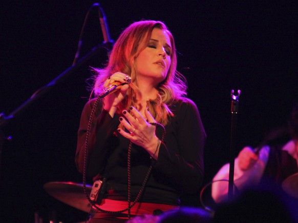 FILE - Lisa Marie Presley performs during her Storm &amp; Grace tour on June 20, 2012, at the Bottom Lounge in Chicago. Presley — the only child of Elvis Presley and a singer herself — was hospitalize ...