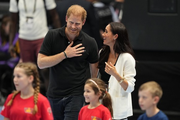 Britain&#039;s Prince Harry, left, and Meghan, The Duchess of Sussex walk on a court at the Invictus Games in Duesseldorf, Germany, Wednesday, Sept. 13, 2023. Harry founded the Invictus Games to aid t ...