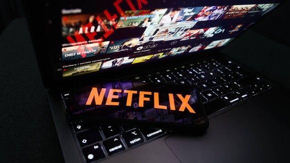 Popular Streaming Services Photo Illustrations Netflix logo displayed on a phone screen and Netflix website displayed on a laptop screen are seen in this illustration photo taken in Krakow, Poland on  ...