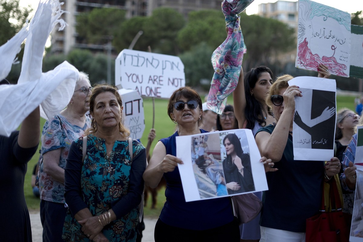 Israeli women chant &quot;women, life, freedom,&quot; as they wave scarves during a protest in solidarity with Mahsa Amini, a young Iranian woman who died after being arrested in Tehran by Iran&#039;s ...